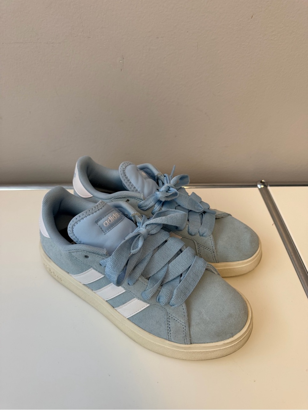 Adidas women’s Suede Sneakers in Light Blue